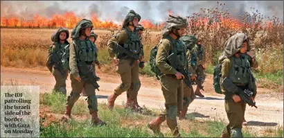  ?? PHOTO: GETTY IMAGES ?? The IDF patrolling the Israeli side of the border with Gaza on Monday