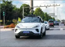  ?? PROVIDED TO CHINA DAILY ?? A Baidu robotaxi runs on a street in Chongqing.