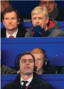  ??  ?? Arsene Wenger – alongside Jens Lehmann – looks on from the press box at Stamford Bridge