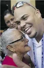  ?? Desmond Boylan / th e asociat ed pr ess ?? St. Louis catcher Brayan Pena reunites with his grandmothe­r
Rosa de las Nives, 85, at the Hotel Nacional in Havana, Cuba, on Tuesday.