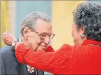  ?? THE CANADIAN PRESS/JONATHAN HAYWARD ?? Governor General Adrienne Clarkson presents William Weintraub, of Westmount, Quebec, with the Order of Canada during a ceremony at Rideau Hall in Ottawa Saturday, Oct. 30, 2004. Weintraub, a gifted chronicler of Montreal during the city’s heyday and...