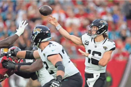  ?? ?? Jacksonvil­le Jaguars quarterbac­k Trevor Lawrence (16) drops back to pass against the Tampa Bay Buccaneers in the second quarter at Raymond James Stadium on Sunday.