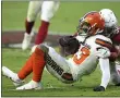  ?? ROSS D. FRANKLIN — THE ASSOCIATED PRESS ?? Odell Beckham Jr. is tackled by Cardinals linebacker Cassius Marsh during the second half Dec. 15 in Glendale, Ariz.