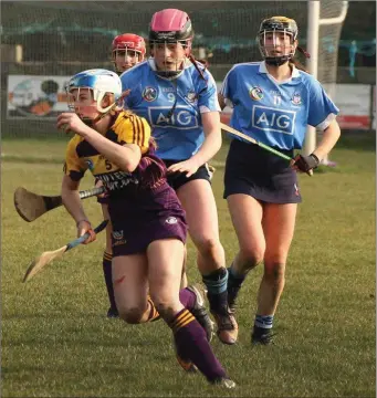  ??  ?? Elaine Quigley on the ball for Wexford as Niamh Gannon and Chloe Mullen track her movements.