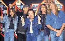  ?? YUI MOK/PA ?? AC/DC band members Malcolm Young, Brian Johnson, Angus Young, Phil Rudd and Cliff Williams pose in London in 2003. The band announced on Saturday that rhythm guitarist and band leader Malcom Young had died at age 64.