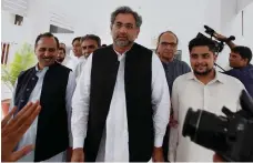  ?? AP ?? Veteran politician Shahid Khaqan Abbasi, centre, insisted he ‘was in power to work, not to keep the seat warm’