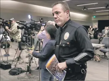  ?? Luis Sinco Los Angeles Times ?? MICHEL MOORE, chief of the LAPD, arrives for a news conference Tuesday to reflect on his first 100 days. Craig Lally, president of the Police Protective League, said Moore has been “very open-minded and accessible.”