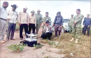  ?? SUPPLIED ?? Officials from the Ministry of Environmen­t and the Kampong Speu Environmen­t Department inspect land that was allegedly illegally sold inside the Phnom Oral Wildlife Sanctuary last month.