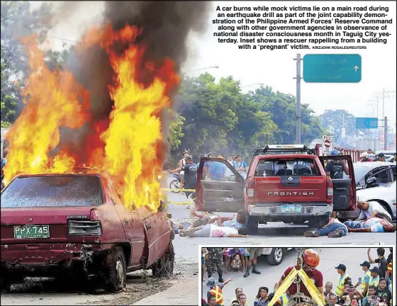  ?? KRIZJOHN ROSALES/REUTERS ?? A car burns while mock victims lie on a main road during an earthquake drill as part of the joint capability demonstrat­ion of the Philippine Armed Forces’ Reserve Command along with other government agencies in observance of national disaster...