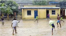  ??  ?? rememberin­g childhood with a soccer game – even in the rain! – at the ndako ya Biso ( Our house) refugee centre for street children.