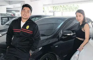  ??  ?? Uber partner drivers Sgt Maj Chinnawat Wannapalo, left, and Tharika Patanarunt.
