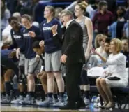  ?? JESSICA HILL — THE ASSOCIATED PRESS ?? Connecticu­t head coach Geno Auriemma, third from right, calls to his players during the second half an NCAA college basketball game against Notre Dame, Sunday in Hartford, Conn.