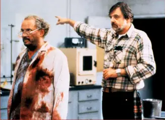  ??  ?? Clockwise from left:
Romero (with Richard Liberty) on the set of 1985’s Day Of The Dead;
Simon Pegg and Edgar Wright prep for their cameo in
Land Of The
Dead (2005), in an image from the Archival Collection; Shoppingma­ll mayhem in Dawn Of The Dead (1978); SFX and make-up guru Greg Nicotero on
Land Of The Dead, from the Archival Collection.