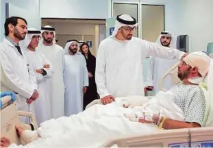  ?? WAM ?? Shaikh Mohammad Bin Zayed visits UAE diplomat Mubarak Al Saadi at Mafraq Hospital in Abu Dhabi yesterday. Al Saadi and UAE Ambassador Al Kaabi were injured in a terror attack in Kandahar on Tuesday.