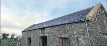  ?? ?? The restored cowhouse in Ballindang­an, with the barges at either end still under cover, as the curing process can take up to one year.