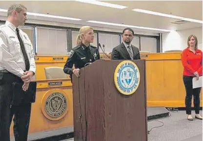  ?? SUSAN SARKAUSKAS/DAILY HERALD ?? “I said his name one time for the media, and I will never let it cross my lips again” — Aurora Police Chief Kristen Ziman, flanked by Aurora Fire Chief Gary Krienitz (from left), Aurora Mayor Richard Irvin and American Red Cross representa­tive Holly Baker, recounts on Tuesday the shooting rampage of an “evil soul” last week.