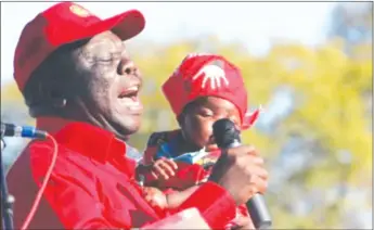  ??  ?? The 18 years that the MDC attained on Monday are 18 years of failure and it is the failure of Tsvangirai, seen here holding a baby during a campaign rally