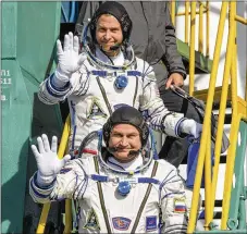  ?? GETTY IMAGES ?? Expedition 57 Flight Engineer Nick Hague of NASA (top) and Flight Engineer Alexey Ovchinin of Roscosmos wave farewell prior to boarding the Soyuz MS-10 spacecraft for launch last Thursday in Kazakhstan.