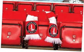  ??  ?? Tribute: A scarf on PC Palmer’s seat at Charlton yesterday