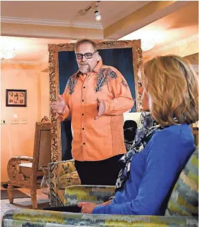  ?? MIKE ROY FOR KAISER HEALTH NEWS ?? Michael Uvanni of Rome, N.Y., speaks to a client, Laura Tardugno, in one of his interior design business showrooms. Uvanni was devastated when his brother James, 66, died from cancer after more than three years of specialize­d treatment.