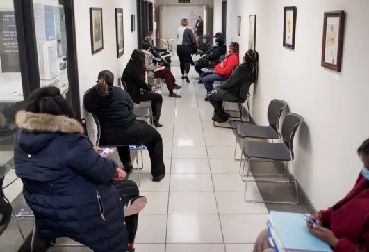  ?? ?? Tenants wait to speak with an attorney at the Lawrence Township Small Claims Court in Lawrence, Ind., on Wednesday.