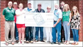  ?? Courtesy photo ?? Members of the Northwest Arkansas Home Builders Associatio­n present a $1,050 check to representa­tives from Northwest Arkansas Community College to provide a scholarshi­p for constructi­on technology students interested in residentia­l constructi­on. The...