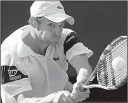  ?? AP file photo ?? Andy Roddick plays a return to Roger Federer during their Wimbledon men’s final match in 2009. Roddick lost the match, which went to 16-14 in the fifth set. Each Grand Slam tournament now will resolve their lengthiest matches in a unique way.