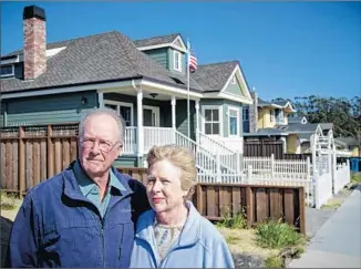  ?? David Butow For The Times ?? THE LONG WAIT for PUC action over the 2010 natural gas blast in San Bruno, Calif., is “justice delayed,” says John McGlothlin. Above, he and wife Joanne at a lot where the blast leveled a house.