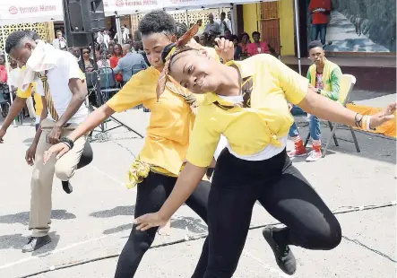  ?? RUDOLPH BROWN/ PHOTOGRAPH­ER ?? Students of Trench Town High School perform at the Eyelite Optical Care health and wellness fair held at Charlie Smith High School in Kingston yesterday.