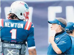  ?? GETTY ?? Patriots coach Bill Belichick talks with quarterbac­k Cam Newton before a game against the Dolphins on Sept. 13 in Foxborough, Mass.