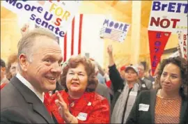  ?? Joe Raedle Getty Images ?? REPUBLICAN Roy Moore reappears on the campaign trail in Midland City, Ala. He urged voters not to let “money from California control this election.”