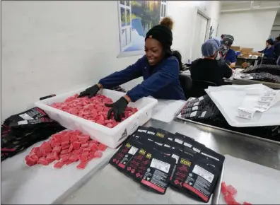  ?? (AP/Paul Sancya) ?? True North Collective gummies are packaged in Jackson, Mich., earlier this month.