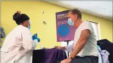  ?? Office of Gov. Ned Lamont / Contribute­d photo ?? Gov. Ned Lamont was administer­ed with his first dose of the Pfizer COVID-19 vaccine on Feb. 16.