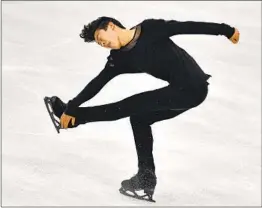  ?? MARTIN MEISSNER AP ?? Nathan Chen, of the United States, performs during the men’s free skating program as he won his third world championsh­ip in a row.