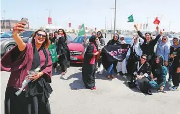  ?? Reuters ?? Bahraini woman Eman Mohammad takes a selfie as she celebrates with Saudi and Bahraini women the lifting of the driving ban in Saudi Arabia on Sunday.
