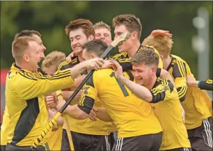  ??  ?? Fort William players celebrate the winning penalty, scored by Mark Grant, front centre.