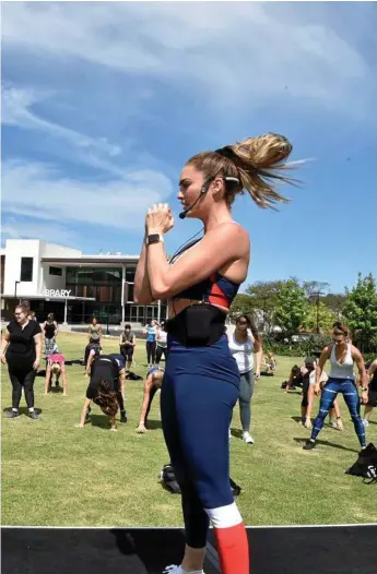  ?? Photo: Bev Lacey ?? GROUP EXERCISE: Emily Skye takes about 50 people through a workout in Civic Square.