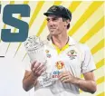  ?? AFP ?? Australia’s Pat Cummins celebrates with the Ashes trophy.
