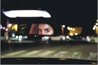  ?? Nariman El-Mofty / Associated Press ?? Hessah al-Ajaji drives her car down the capital’s busy Tahlia Street after midnight for the first time in Riyadh, Saudi Arabia, on Sunday. Saudi women are in the driver’s seat for the first time after the world's last remaining ban on women driving was...