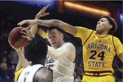  ?? AP PHOTO/JEFF CHIU ?? California forward Grant Anticevich, center, is defended by Arizona State forward Jalen Graham (24) during the first half of an NCAA college basketball game in Berkeley, on Sunday.