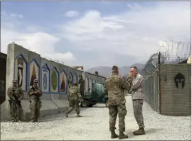  ??  ?? Marine Gen. Joseph Dunford, chairman of the Joint Chiefs of Staff (right) talks with top U.S. commander in Afghanista­n Gen. John Nicholson at Tactical Base Gamberi in eastern Afghanista­n on Wednesday. Dunford says he’s optimistic about Afghanista­n...