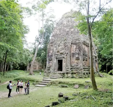  ??  ?? Tourists visit Sambor Prei Kuk, or ‘the temple in the richness of the forest’, an archaeolog­ical site of ancient Ishanapura, which has been listed as a Unesco world heritage site, in Kampong Thom province, Cambodia. — Reuters photo