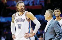  ?? [PHOTO BY SARAH PHIPPS, THE OKLAHOMAN] ?? Oklahoma City coach Billy Donovan, right, talks to Steven Adams during Wednesday’s preseason game against the Detroit Pistons at Chesapeake Energy Arena.