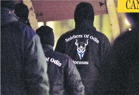  ?? MINNA RAITAVUO/LEHTIKUVA VIA AP ?? Soldiers of Odin members demonstrat­e in Finland in 2016. The Canadian chapter has broken with the European mother group amid controvers­y.