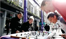  ?? ?? Germany’s Ann-Katrin Berger (top right) and France’s Kenza Dali (right) play England’s Jess Carter (left) and Millie Bright at table football at a launch event. Photograph: John Phillips/Getty