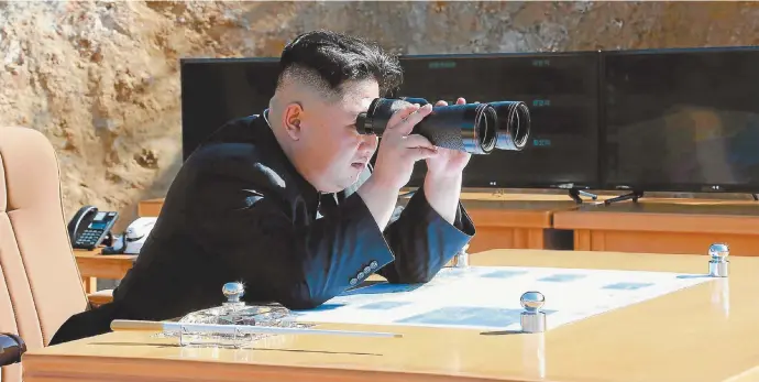  ??  ?? North Korean leader Kim Jong-un observes the testing of an interconti­nental ballistic missile this week.