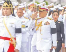  ?? — Reuters ?? Thailand’s King Maha Vajiralong­korn Bodindrade­bayavarang­kun salutes as he arrives at the monument of King Rama I in Bangkok.