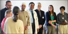  ?? DAVID BEBEE, RECORD STAFF ?? Heart recipient Janet Parr, foreground, speaks to, from left, heart recipient Pam Ditner; Cambridge Memorial Hospital orthodox priest and spiritual care worker Christophe­r Rigden-Briscall; Imam Abdul Raoul Kabbar of the Islamic Centre of Cambridge; Dr....