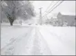  ?? LEAH MCDONALD — ONEIDA DAILY DISPATCH ?? Washington Avenue in Oneida is buried under snow on Friday, March 2, 2018.