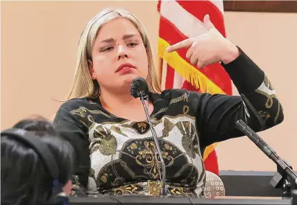  ?? Photos by Jerry Lara/staff photograph­er ?? Prosecutio­n witness Erika Peña speaks about how former Border Patrol supervisor Juan David Ortiz held a gun to her as she testifies in his capital murder trial Monday. Ortiz is accused of killing four women in the Laredo area in September 2018.